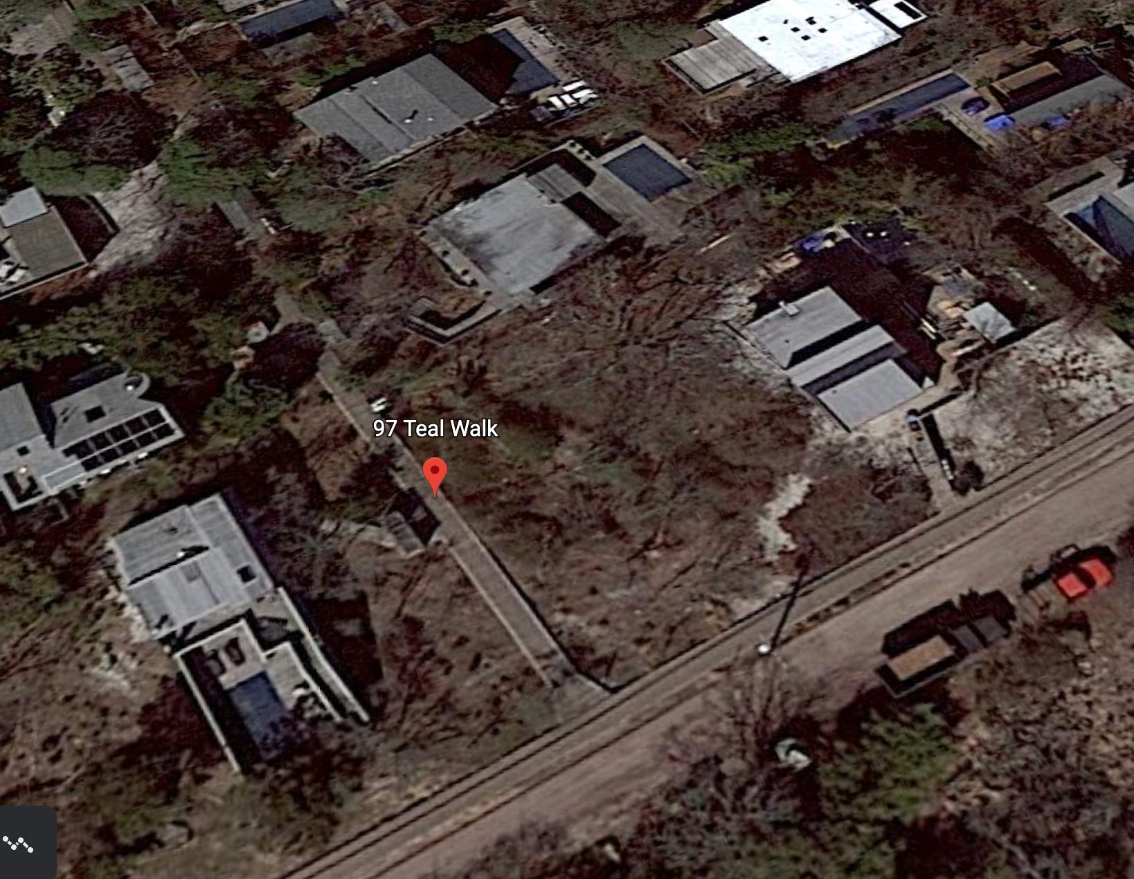 Google Earth close-up image showing 97 Teal Walk near Teal Walk and Fire Island Boulevard.